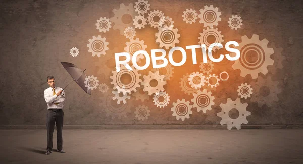 Бизнесмен Защищающийся Зонтиком Надписи Robotics Технологическая Концепция — стоковое фото
