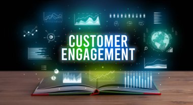 Açık bir kitaptan çıkan Müşteri Katılımı yazıt, yaratıcı iş konsepti