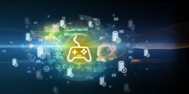 Oyun denetleyici simgeleri ile yumuşak jest multimedya ekranı ile el teması, karanlık arkaplan üzerinde gelecek teknoloji konsepti