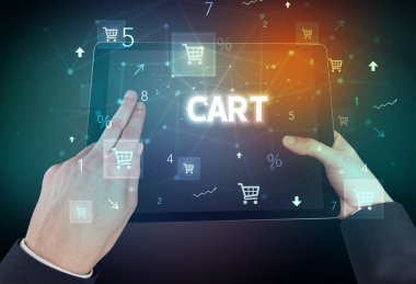 CART yazıtlı, çevrimiçi alışveriş konsepti olan bir el tutma tabletinin yakın çekimi