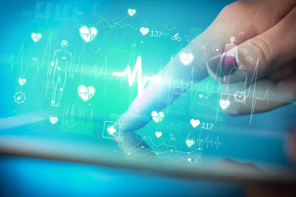 stock image Close-up of a touchscreen with ECG icons, modern healthcare concept