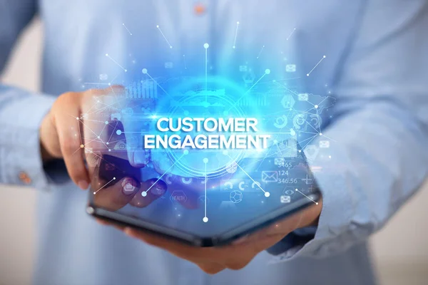Businessman Holding Foldable Smartphone Customer Engagement Inscription New Business Concept — Stock Photo, Image