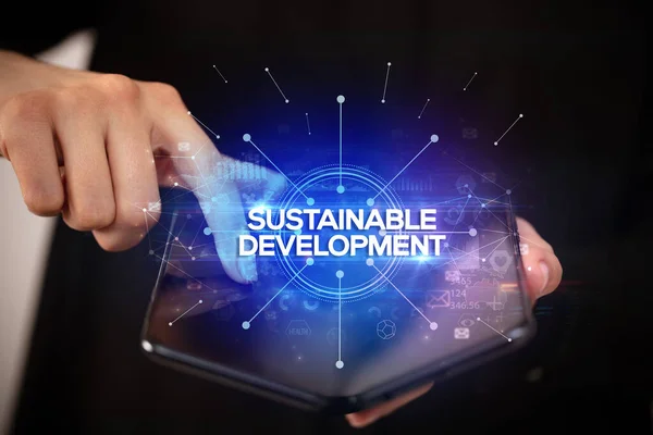 Empresário Segurando Smartphone Dobrável Com Inscrição Sustentável Desenvolvimento Novo Conceito — Fotografia de Stock