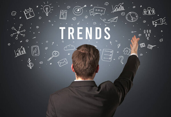Rear view of a businessman with TRENDS inscription, modern business concept