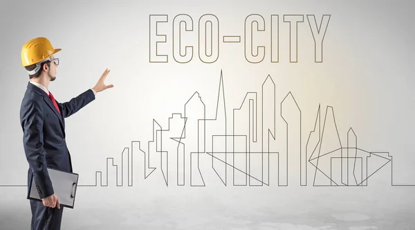 Empresario Casco Duro Sosteniendo Plano Con Inscripción Eco City Concepto —  Fotos de Stock
