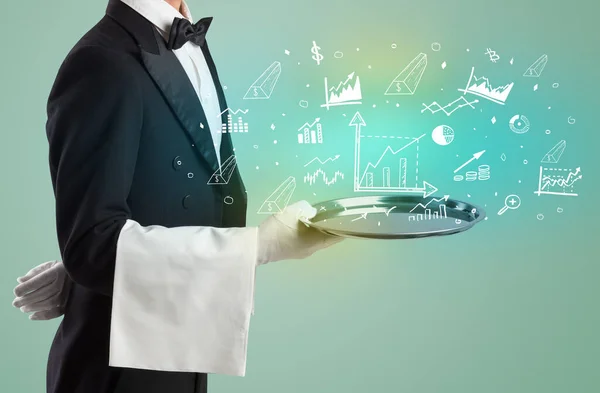 stock image Handsome young waiter in tuxedo holding tray with chart icons on tray, global market concept