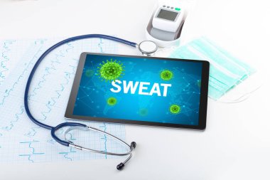 SWEAT yazıtları ve mikrobiyoloji kavramına sahip bir tabletin yakın plan görüntüsü