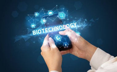 BIOTECHNOLOGY yazıtlı akıllı telefon, modern teknoloji konsepti