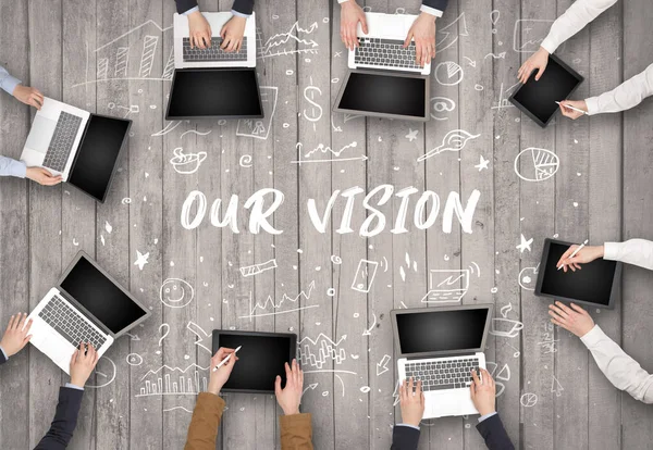 stock image Group of business people working in office with OUR VISION inscription, coworking concept