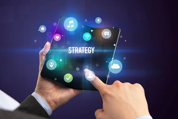 Zakenman Met Een Opvouwbare Smartphone Met Strategy Inscriptie Social Media — Stockfoto