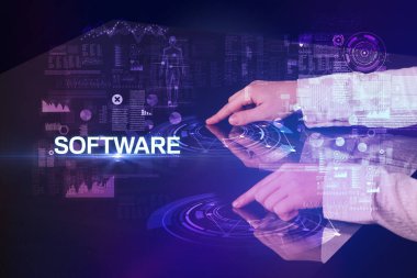 İş adamı SOFTWARE yazıtları ve modern teknoloji konseptiyle büyük ekrana dokunuyor