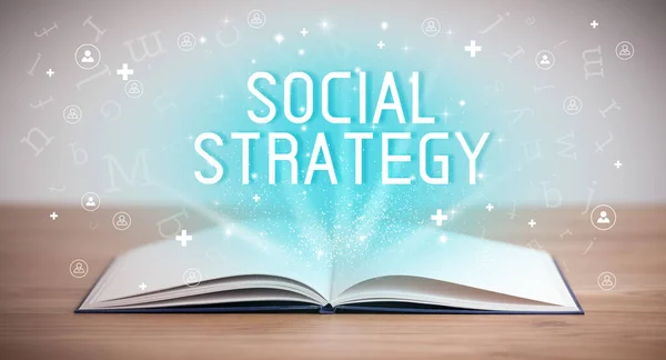 Open book with SOCIAL STRATEGY inscription, social media concept