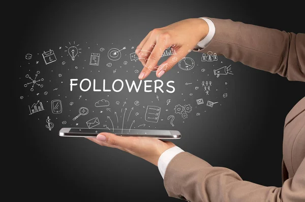 stock image Close-up of a touchscreen with FOLLOWERS inscription, social media concept