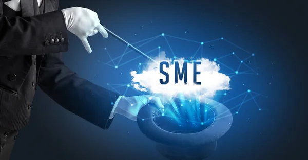 stock image Magician is showing magic trick with SME abbreviation, modern tech concept