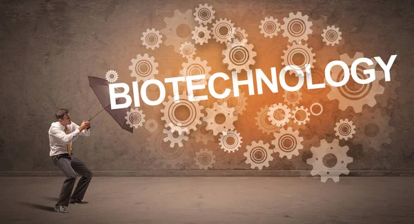 Бизнесмен Защищающийся Зонтиком Надписи Biotechnology Технологической Концепции — стоковое фото