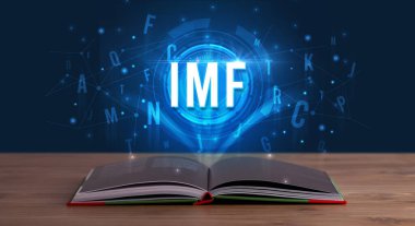 Açık bir kitaptan çıkan IMF yazımı, dijital teknoloji konsepti