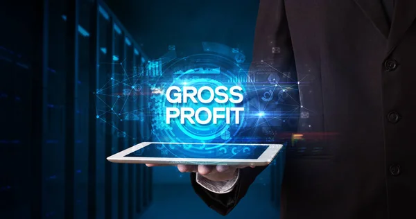 Young Business Person Working Tablet Shows Inscription Gross Profit Business — Stock Photo, Image