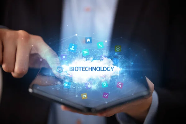 Businessman Holding Foldable Smartphone Biotechnology Inscription Technology Concept — Stock Photo, Image