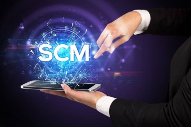 SCM kısaltmalı bir dokunmatik ekran, modern teknoloji konsepti