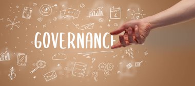 GOVERNANCE yazıtına işaret eden kırpılmış elin yakın çekimi, modern iş çözümleri kavramı