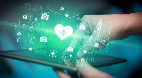 Close-up of a touchscreen with healthcare icons, modern healthcare concept