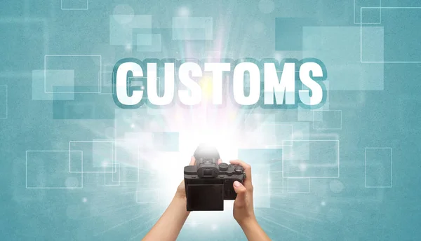 Close Hand Holding Digital Camera Customs Inscription Traveling Concept — Stock Photo, Image
