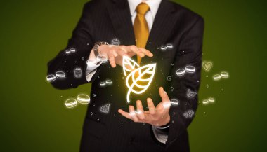 El ele tutuşan yaprak ikonu, sağlıklı yemek teslimatı konsepti