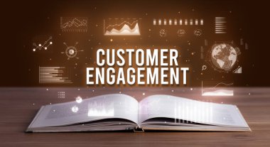 Açık bir kitaptan çıkan Müşteri Katılımı yazıt, yaratıcı iş konsepti