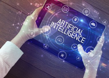 ARTIFICIAL INTELLIGENCE yazıtlı, yenilikçi teknoloji kavramına sahip bir tabletin yakın çekimi