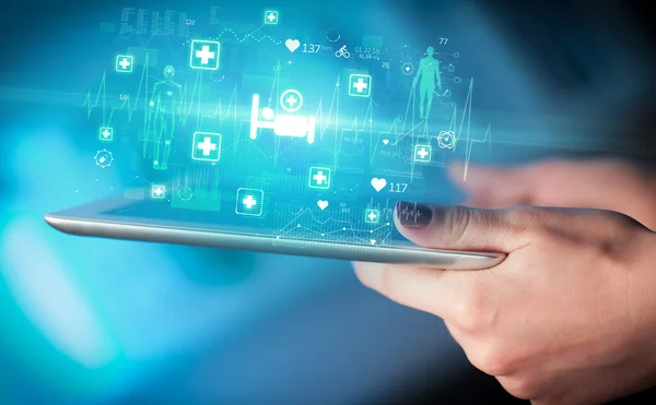Close-up of a touchscreen with lying patient icons, modern healthcare concept
