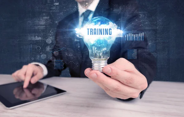 Businessman Holding Light Bulb Training Inscription New Business Concept — Stock Photo, Image