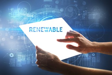 El işi fütüristik tablet. Yenilenebilir yazıtlar, yeni teknoloji kavramı.