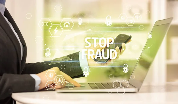 STOP FRAUD inscription on laptop, internet security and data protection concept, blockchain and cybersecurity