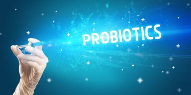 Şırınga, elinde PROBIOTICS yazısıyla tıbbi enjeksiyon, tıbbi panzehir konsepti