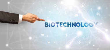 BIOTECHNOLOGY yazıtlarına el işareti, modern teknoloji kavramı