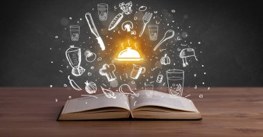 İçinde sıcak yemek simgeleri olan açık tarif kitabı, gastronomi konsepti.