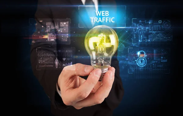 Biznesmen Trzymający Żarówkę Napisem Web Traffic Koncepcja Bezpieczeństwa Online — Zdjęcie stockowe