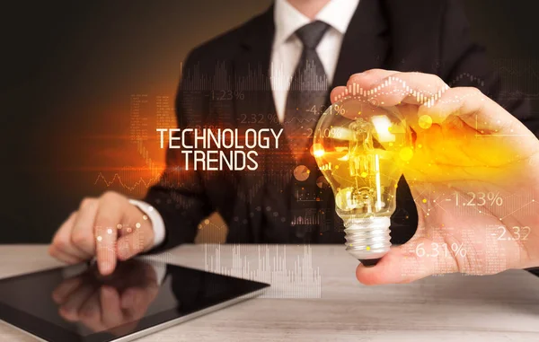 Podnikatel Držící Žárovku Nápisem Technology Trends Business Technology Concept — Stock fotografie