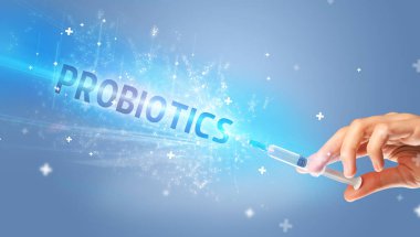 Şırınga, elinde PROBIOTICS yazısıyla tıbbi enjeksiyon, tıbbi panzehir konsepti