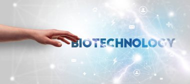 BIOTECHNOLOGY yazıtlarına el işareti, modern teknoloji kavramı