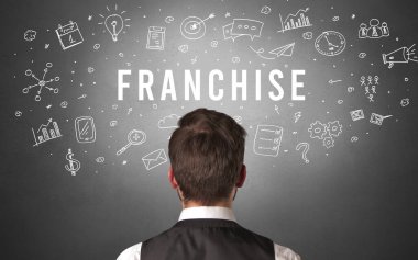 FRANCHISE yazıtları, modern iş konsepti olan bir işadamının arka görüşü
