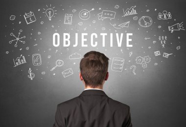 OBJECTIVE yazıtları olan bir iş adamının arka görüşü, modern iş kavramı