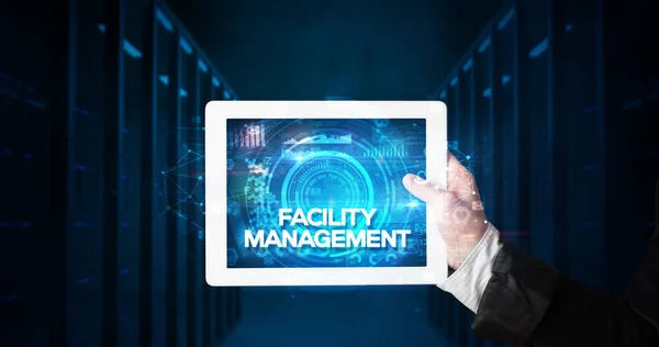 Young Business Person Working Tablet Shows Inscription Facility Management Business — Stock Photo, Image