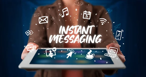 Young Business Person Working Tablet Shows Inscription Instant Messaging — Stock Photo, Image