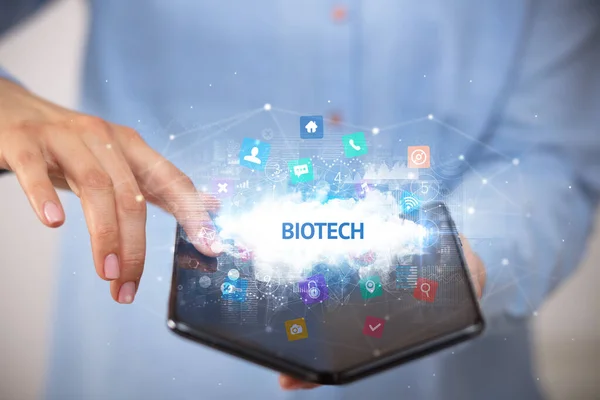 Businessman Holding Foldable Smartphone Biotech Inscription Technology Concept — Stock Photo, Image