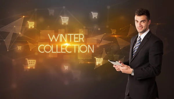 ショッピングカートのアイコンと冬のコレクションの碑文を持つビジネスマン オンラインショッピングコンセプト — ストック写真