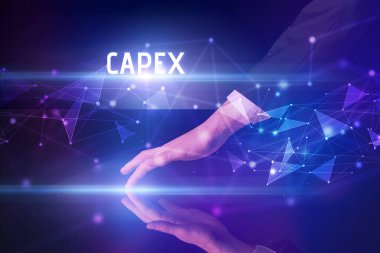 İş adamı CAPEX yazısıyla büyük ekrana dokunuyor, modern teknoloji iş konsepti