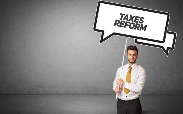 Jonge Zakenman Casual Holding Verkeersbord Met Taxes Reform Inscriptie Nieuw — Stockfoto