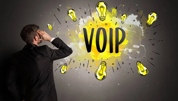 Business Man Drawing Colorful Light Bulb Voip Abbreviation New Technology — стоковое фото