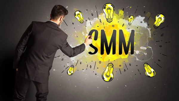 Businessman Drawing Colorful Light Bulb Smm Abbreviation New Technology Idea — Stock Photo, Image